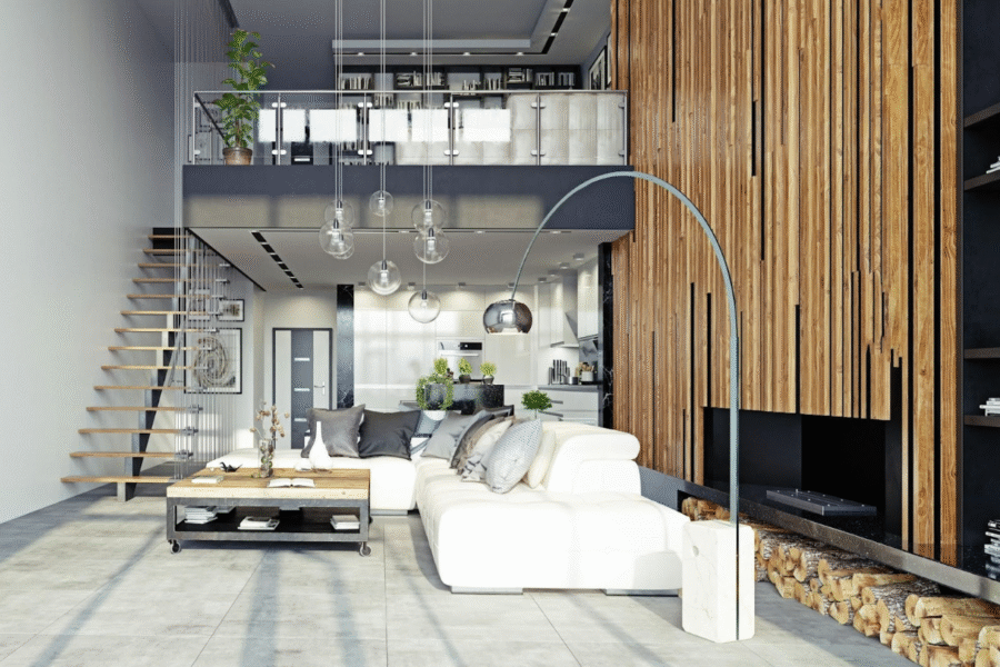 Interior of a modern, open-plan loft with a white sofa, wooden accent wall, and a floating staircase.